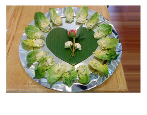 Caesar salad served in a baby gem lettuce leaf